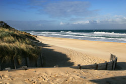Beaches make popular tourist resorts. This is Ninety Mile Beach at Lakes Entrance, Victoria, Australia