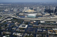 New Orleans after Katrina passed.  Note the flooding and the damage to the roof of the Superdome.