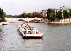  A  tourist boat travels the River Seine in Paris, France 