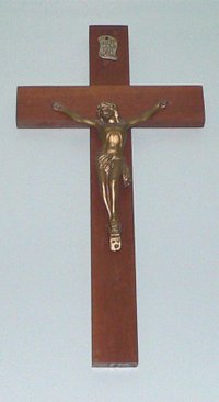 The Crucifix, bearing the image of Jesus suffering on a cross, often serves as a symbol of the Roman Catholic Church.