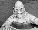 The Creature from the Black Lagoon in the water.