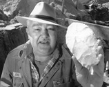 Calvin Jones holding stone blade.