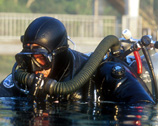 Photo of a scuba diver preparing to dive.