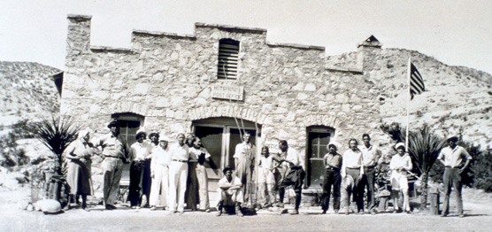 Visitors stand in front of the Hot Springs store & post office, 1930s