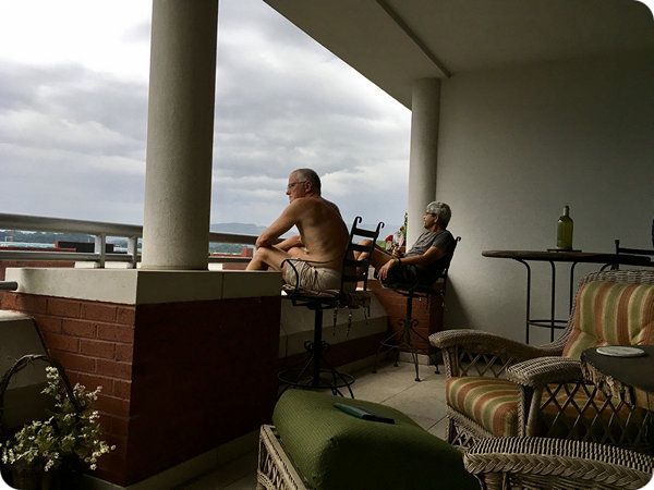 People watching from the condo balcony