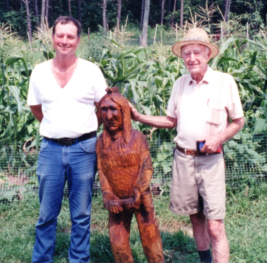 John Fichtner and George H Breiding with John's chainsaw sculptures - September 2000